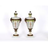 A pair of 20th Century continental porcelain and gilt metal mounted baluster vases and covers,