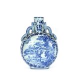 A large Chinese style blue and white moon flask, with applied dragon handles, decorated with rural