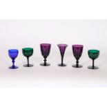 A collection of Antique coloured drinking glasses, including amethyst, green and Bristol blue