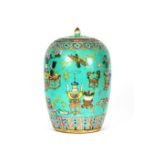 A 19th Century Chinese lidded ovoid jar, decorated flowers and objects on a turquoise ground, 33cm