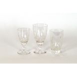 A part suite of glassware, having line and dimple decoration on baluster stems and circular spread