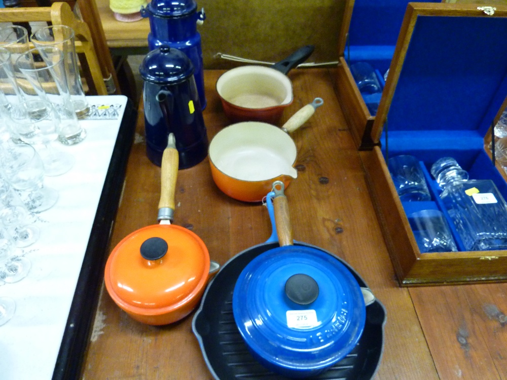 A quantity of Le Creuset and other saucepans; an e