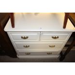 A modern cream painted chest fitted two short over