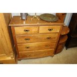 An oak chest fitted two short over three long draw