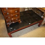 A steel and black glass top coffee table