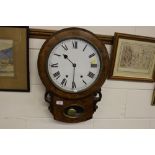 A Victorian walnut two hole drop dial wall clock