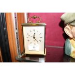 A quartz brass cased mantel clock