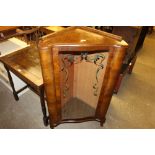 A 1960's walnut and glazed corner cabinet