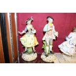 A pair of Meissen figures dressed in 18th Century