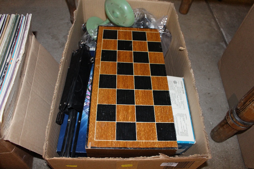 A box containing chess boards; board games etc.