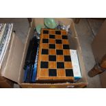 A box containing chess boards; board games etc.