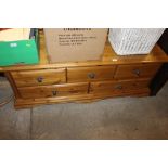 A low pine five drawer chest