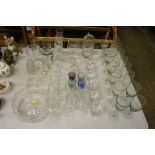 A quantity of various drinking glasses; a fruit bo