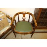 An Edwardian mahogany and inlaid tub chair