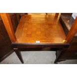 A mahogany and inlaid games table