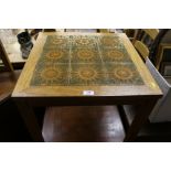 A teak and tile top coffee table