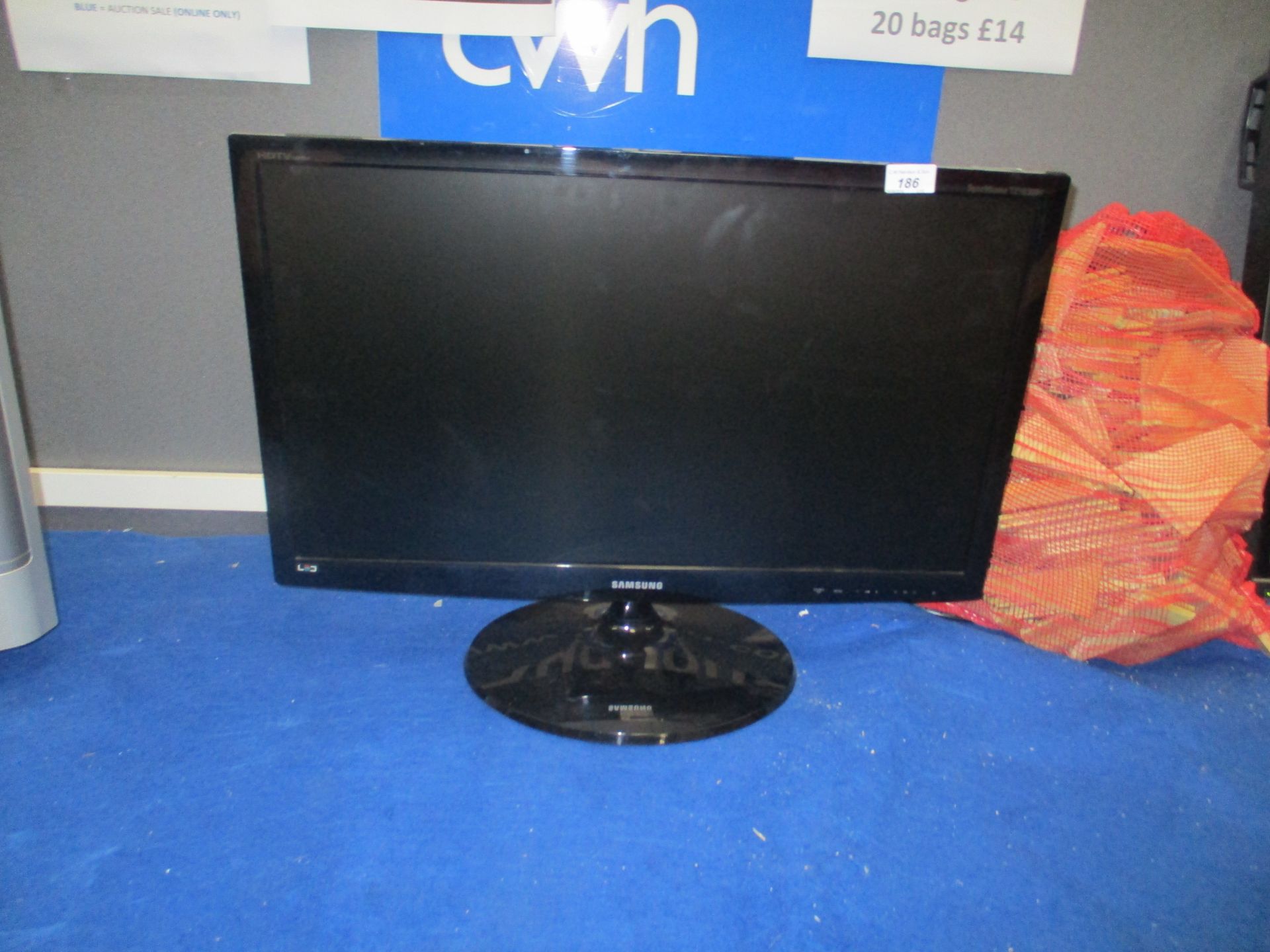 A Samsung LT27B300EWYEN 27" TV complete with power lead and remote control