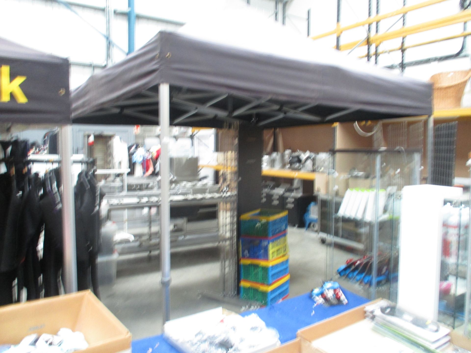 A galvanised framed folding gazebo approx 3M x 3M complete with 3 boxes containing side panels,