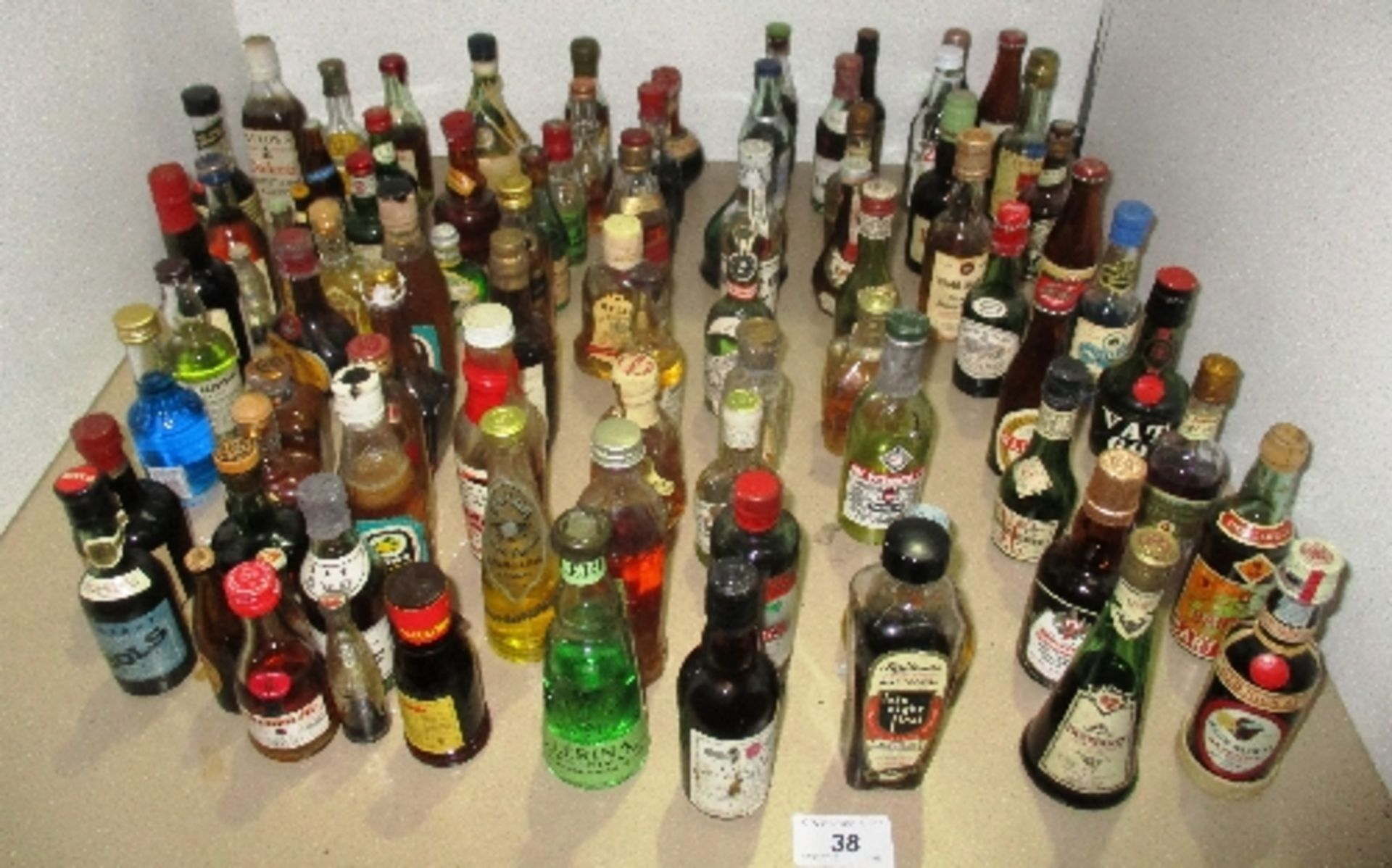 A collection of approx 80 miniature beer, spirit and liqueur bottles for decoration only - full,