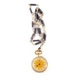 An 18ct Gold white and purple enamelled lady's fob watch hung from a white metal purple and white
