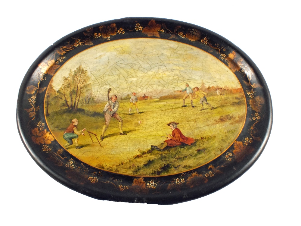 A 19th Century oval papier mache tray painted with an early cricket match scene (some edge chips)