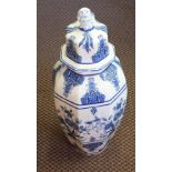 A large Delft jar and lid,