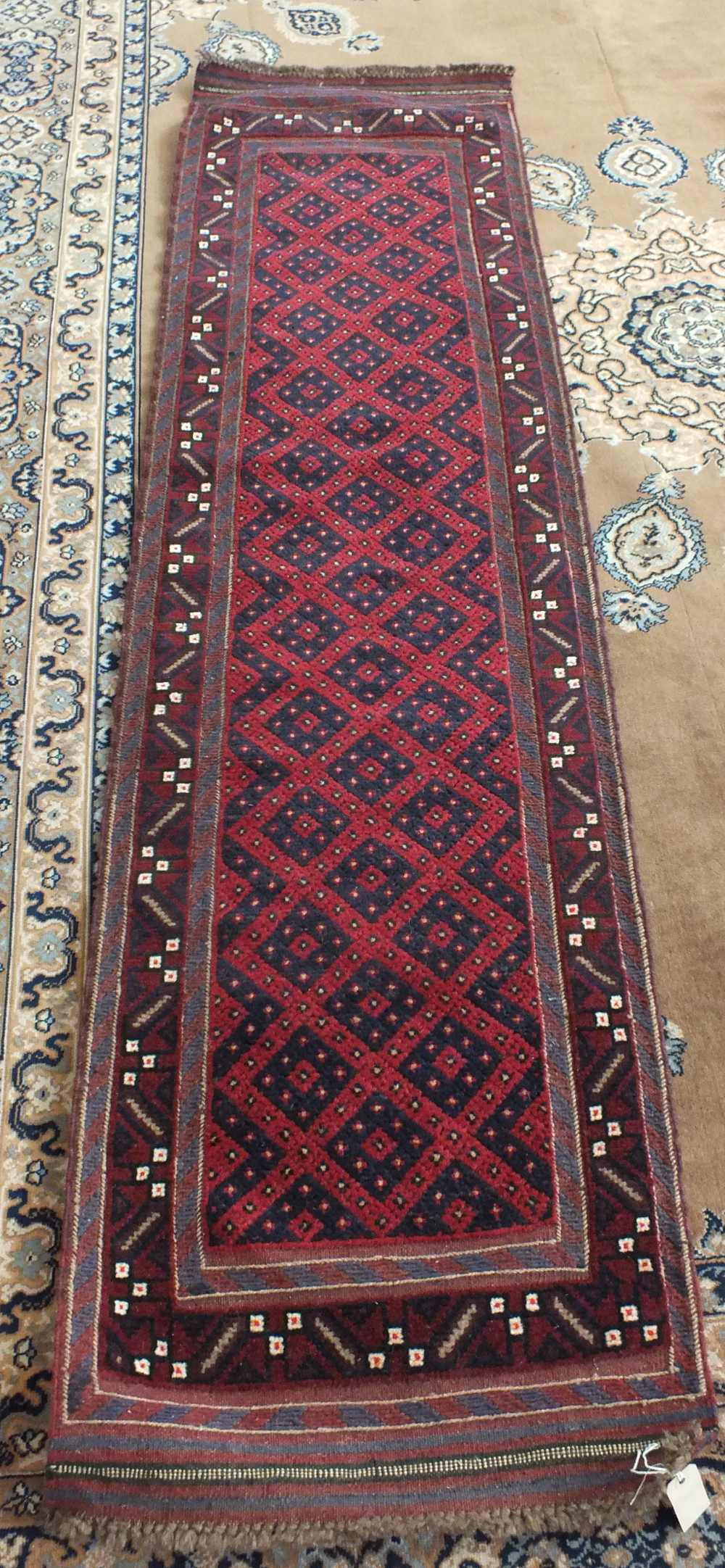 A Persian red ground runner,