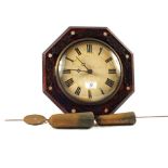 A 19th Century octagonal dial clock with carved and Mother of Pearl decoration