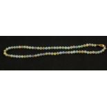 An Opal bead necklace with 18ct Gold clasp