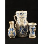 A 19th Century Parian blue decorated bird and grape vase plus two others