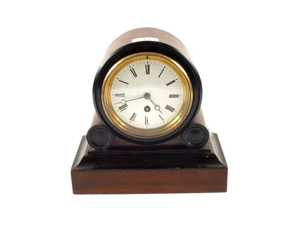 A Walnut and ebonised dome top mantel clock