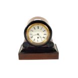 A Walnut and ebonised dome top mantel clock