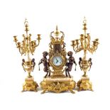 An Italian gilt metal clock garniture with cherub supports and rouge marble,