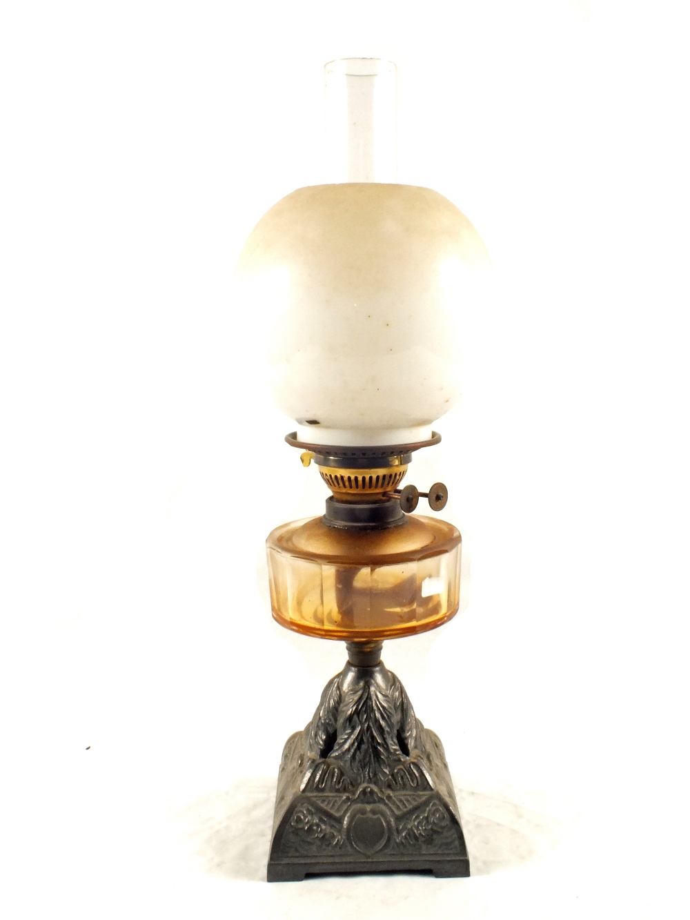 A cut glass iron base oil lamp