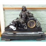 A large and heavy black slate clock with bronzed mount of a seated Greek figure,