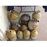 Ten stoneware flagons, local makers including Dady, Morsey Woods, Hunter, Bullard,