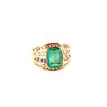 A large 18ct Gold Emerald and Diamond set ring,