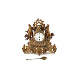 A gilt spelter figure mounted mantel clock