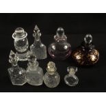 A ruby glass scent bottle and seven others