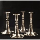 Four Swiss Silver table candlesticks, the trumpet shaped stems fluted and lobed below the knops,
