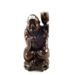 A Chinese carved hardwood seated Buddha table lamp,