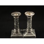 A pair of 19th Century Wedgwood silver resist lustre candlesticks (damage)