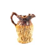 An antique stoneware Silenus jug in high relief,