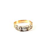 A Gold five stone Diamond ring in closed back setting, estimated total Diamond weight 1.
