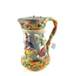 A large Minton Majolica Carnival Castle flagon decorated in relief with Mediaeval figures and