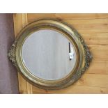 A 19th Century oval gilt wall mirror