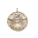 A large Diamond set brooch/pendant of circle form decorated with leaf and ribbon decoration