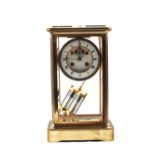A late 19th Century four glass Brass mantel clock