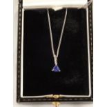 An 18ct Gold Tanzanite and Diamond pendant on an 18ct White Gold chain