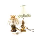 A Brass seated girl table lamp and one other